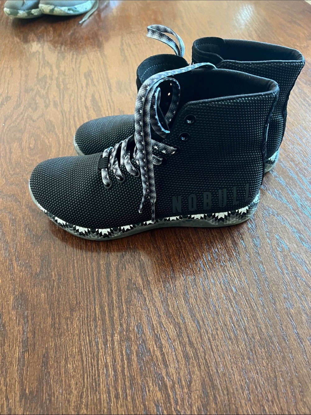 NOBULL Black High-Top Trainer with Marble-Patterned Sole